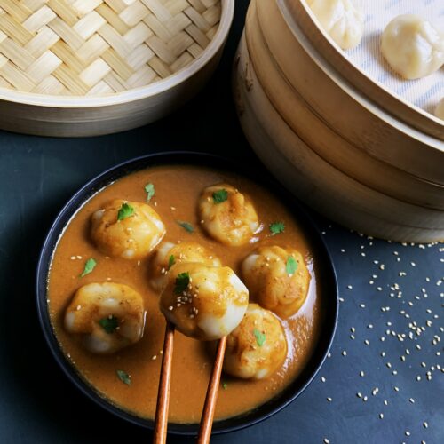 bowl of jhol momo with chopsticks