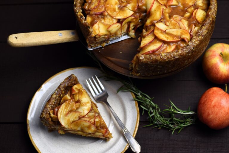 slice of raw apple pie next to whole pie