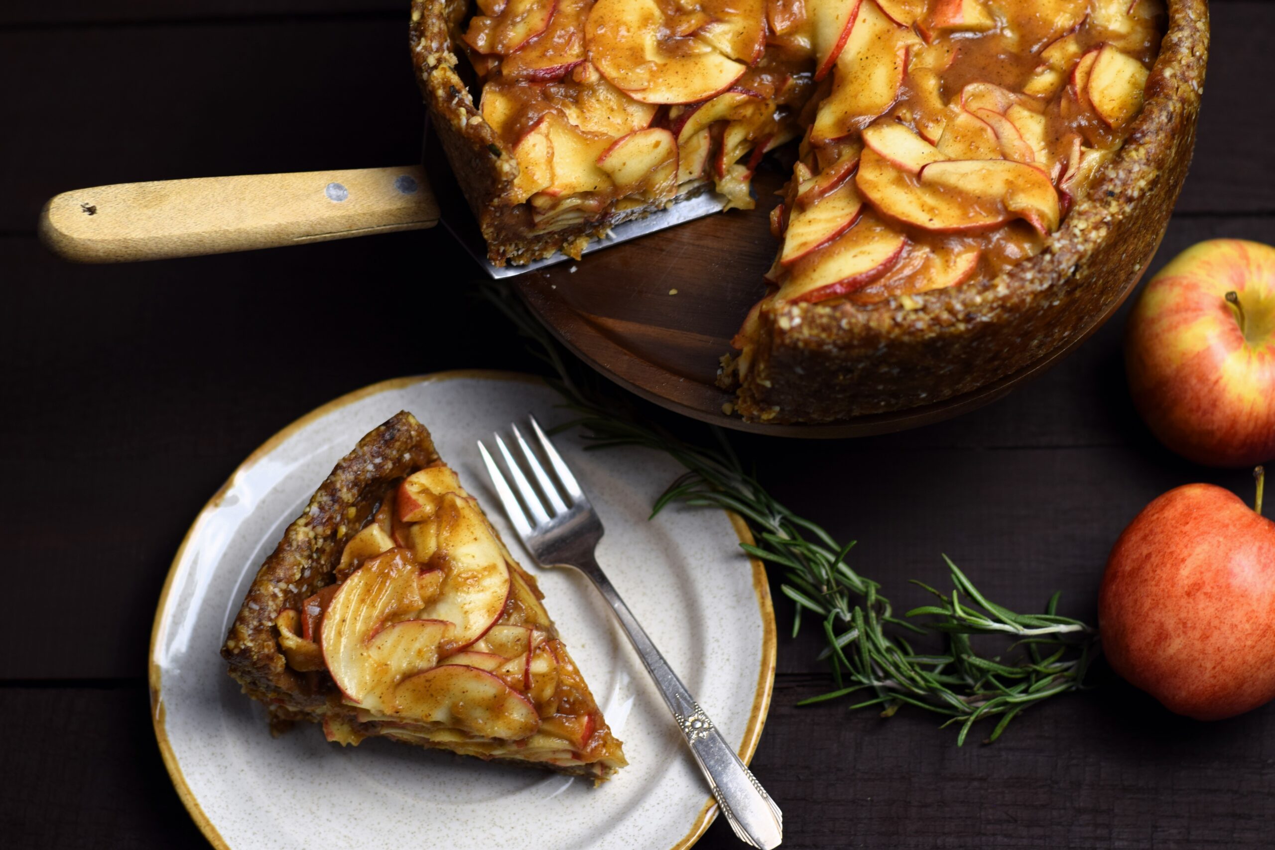 slice of raw apple pie next to whole pie